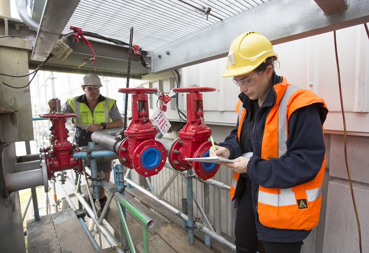 Staff check the equipment at a water treatment plant